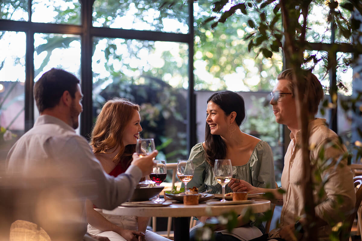 Group of four having dinner